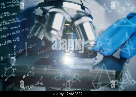 Close-up shot of microscope with metal lens. Stock Photo