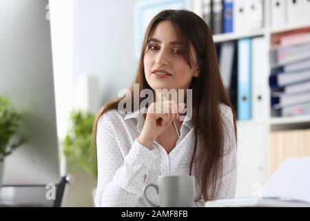 Good-looking woman in white blouse Stock Photo