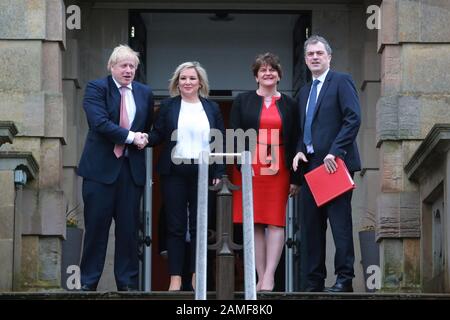 Belfast, Northern Ireland. 13th Jan 2020. British Prime Minister Boris Johnston (left) and Secretary of State for Northern Ireland Julian Smith (right) is greeted by the new Deputy First Minister Michelle O'Neill and First Minister Arlene Foster at Stormont Castle, Belfast, Northern Ireland on Jan 13, 2020. Prime Minister Boris Johnson has arrived at Stormont to mark the restoration of devolution in Northern Ireland. Taoiseach (Irish prime minister) Leo Varadkar is due later on Monday. Credit: Irish Eye/Alamy Live News Stock Photo