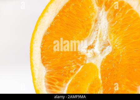 Close up of orange fruit texture on white background. Slice of ripe orange source of vitamin c and healthy lifestyle Stock Photo