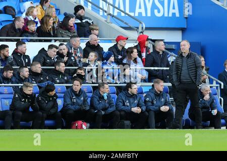 Swansea city manager Steve Cooper (r) watches on from the dugout. EFL Skybet championship match, Cardiff City v Swansea city at the Cardiff City Stadium on Sunday 12th January 2020.  this image may only be used for Editorial purposes. Editorial use only, license required for commercial use. No use in betting, games or a single club/league/player publications. pic by  Andrew Orchard/Andrew Orchard sports photography/Alamy Live news Stock Photo