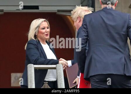 Deputy First Minister Michelle O'Neill (left) of Sinn Fein, greet Prime Minister Boris Johnson and Secretary of State for Northern Ireland, Julian Smith as they arrive at Stormont, Belfast. Stock Photo