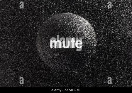 Macro close up photograph of mute button on audio controller. Stock Photo