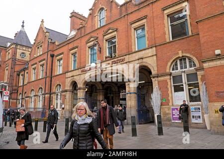 Commuters passengers people on their way to work leaving Marylebone Station outside entrance on a winter morning in London NW1 England UK KATHY DEWITT Stock Photo