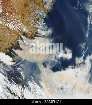 NASA satellite image of Bushfires, Australia Jan 4 2020 coast near Canberra centred on Merimbula Stock Photo