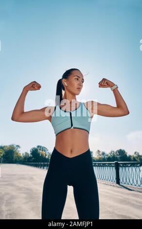 Beautiful Strong Muscular Woman Flexing Her Stock Photo 550838233