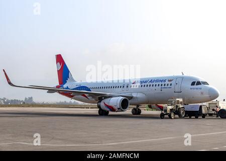Kathmandu, Nepal - November 22 2019: Nepal Airlines Airbus A320 waiting for clearance on taxiway at Tribuvan International Airport in Kathmandu, Nepal Stock Photo