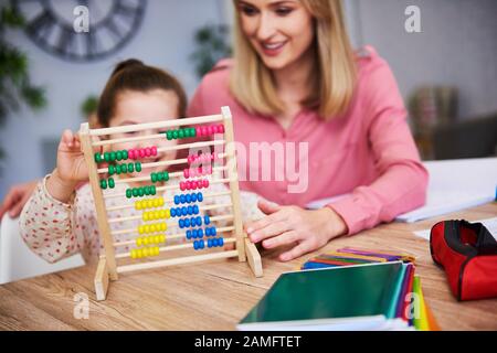 Child learning to count at home Stock Photo
