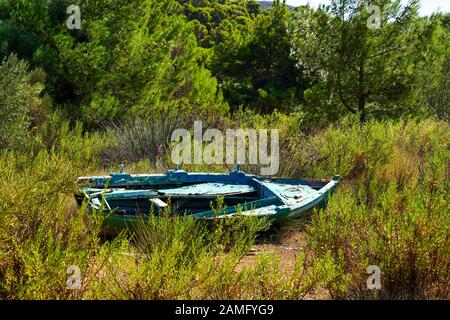 A deserted rowing boat on land Photographed on the Greek Island of Cephalonia, Ionian Sea, Greece