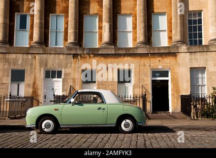 Green Nissan Figaro in Bath, UK Stock Photo