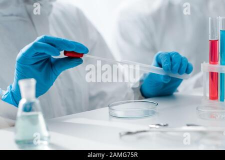 cropped view of scientist in latex gloves doing dna test in lab Stock Photo