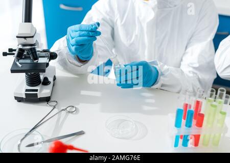 cropped view of scientist doing dna test in lab Stock Photo