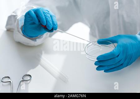 cropped view of scientist in latex gloves doing dna test in lab Stock Photo