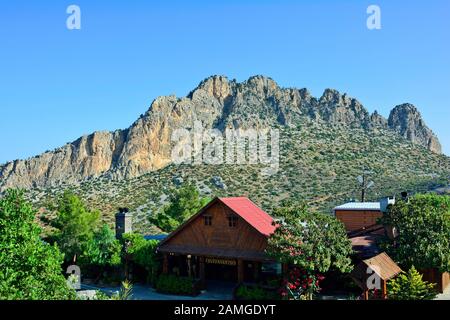 Kyrenia, Cyprus - October 16, 2015: Restaurant in front of Five Finger mountain aka Pentadaktylus Stock Photo