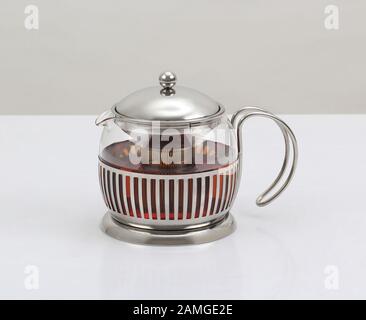 glass teapot with tea ready to serve isolated on white background Stock Photo