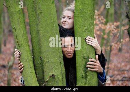Young intercultural and happy student couple during a winter walk in Bottrop, Germany. Stock Photo
