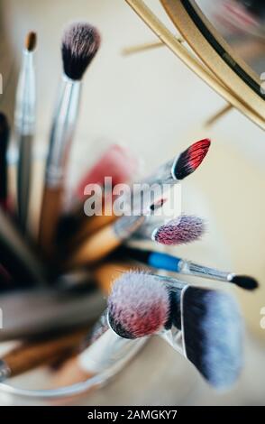 Many different makeup brushes in artist's studio Stock Photo