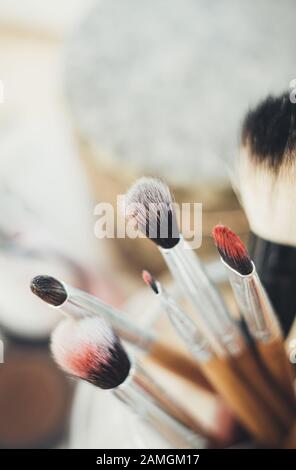Many different makeup brushes in artist's studio Stock Photo