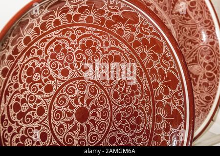 Ethnic Uzbek ceramic tableware. Decorative ceramic plates with traditional uzbekistan ornament.