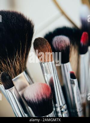 Many different makeup brushes in artist's studio Stock Photo