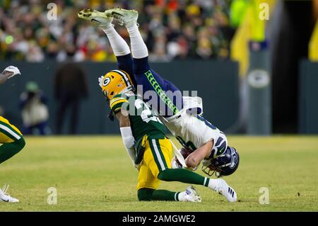 Green Bay, WI, USA. 12th Jan, 2020. Seattle Seahawks tight end Jacob  Hollister #48 lands vertically on his head after being tackled by Green Bay  Packers cornerback Jaire Alexander #23 in the