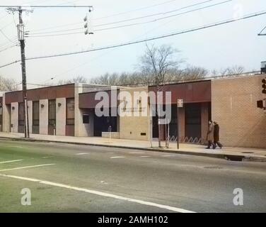 Black and white photograph of the exterior view of the New Dorp Regional Branch of the New York Public Library, Staten Island, New York City, United States, 1972. From the New York Public Library. Note: Image has been digitally colorized using a modern process. Colors may not be period-accurate. () Stock Photo