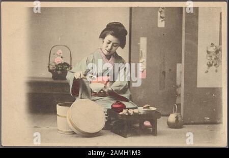 Illustrated postcard of a Japanese woman in traditional kimono kneeling by a low table pouring rice into a bowl, Japan, 1904. From the New York Public Library. () Stock Photo