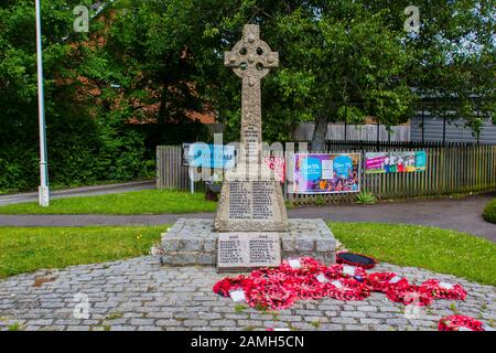 9 June 2017 The Celtic Cross styled marble 1st World War memorial in Warsash on the South Coast of England with poppy wreaths that have been laid ther