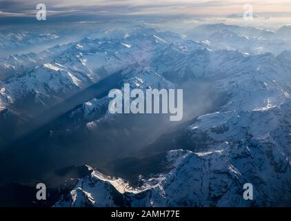 Sunset over the Alps with rays of light Stock Photo