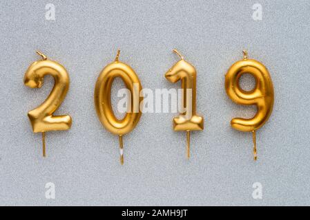 Marry Christmas and happy New Year 2019 layout. Gold candles numbers 2019 Stock Photo