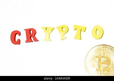 Word crypto made with letterboard on white background and bitcoin. Flat lay Stock Photo