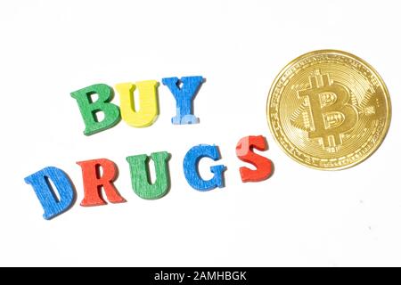 Buy drugs made with letters of different color on white background top view. Buying drugs for bitcoin and cryptocurrency concept Stock Photo