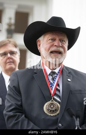 Austin, Texas, USA. 13th Jan, 2020. Austin, TX USA Jan. 13, 2020: Church shooting hero JACK WILSON of White Settlement (l) speaks to the media after accepting the Governor's Medal of Courage at the Texas Governor's Mansion. Wilson fired one round and killed a suspected church shooter on Dec. 29, 2019. Credit: Bob Daemmrich/ZUMA Wire/Alamy Live News Stock Photo
