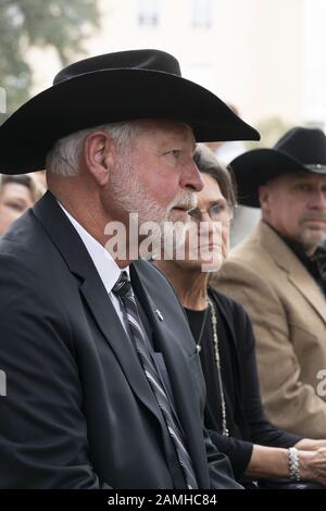 Austin, Texas, USA. 13th Jan, 2020. Austin, TX USA Jan. 13, 2020: Church shooting hero JACK WILSON of White Settlement (l) waits to accept the Governor's Medal of Courage at the Texas Governor's Mansion. Wilson fired one round and killed a suspected church shooter on Dec. 29, 2019. Credit: Bob Daemmrich/ZUMA Wire/Alamy Live News Stock Photo
