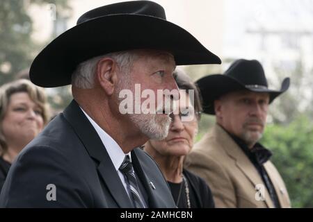 Austin, Texas, USA. 13th Jan, 2020. Austin, TX USA Jan. 13, 2020: Church shooting hero JACK WILSON of White Settlement (l) waits to accept the Governor's Medal of Courage at the Texas Governor's Mansion. Wilson fired one round and killed a suspected church shooter on Dec. 29, 2019. Credit: Bob Daemmrich/ZUMA Wire/Alamy Live News Stock Photo