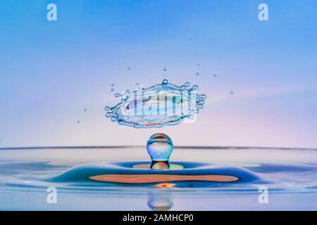 High speed water drop photograph with colliding drops Stock Photo