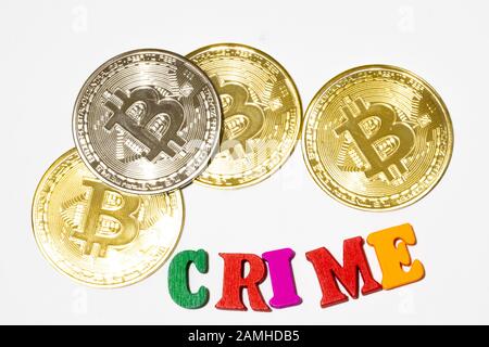 Cryptocurrency crime concept. Bitcoin on white background flat lay Stock Photo