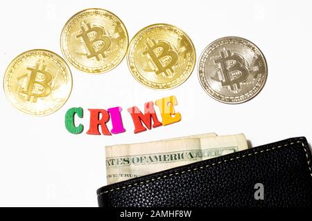 Word crime with bitcoin and money in wallet on white background. Crypto crime concept. Criminal use of cryptocurrency Stock Photo