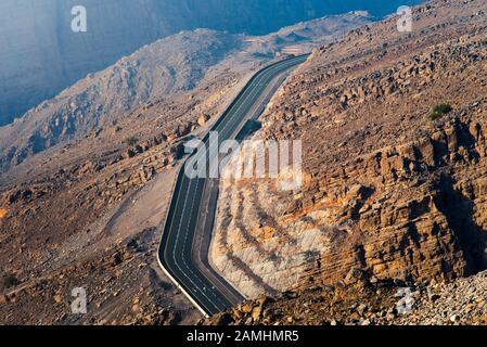 Desert mountain road on the Jais mountain in the UAE aerial view Stock Photo