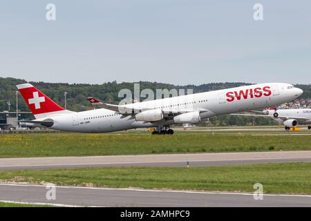 Zurich, Switzerland - April 28, 2018: Swiss International Airlines Airbus A340 airplane at Zurich airport (ZRH) in Switzerland. Airbus is an aircraft Stock Photo