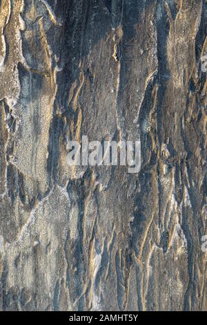 Structural gray aged stucco on the facade of the house. Creative vintage background Stock Photo