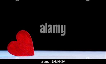 Valentine's Day Background. Red Heart On A Wooden Background Stock Photo