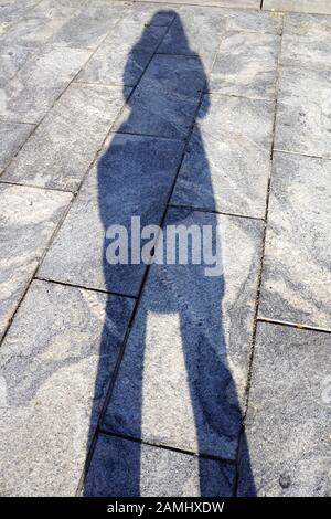 A person's shadow on hard surface Stock Photo