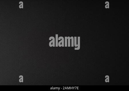 Black background from textured paper. Gradient lighting Stock Photo