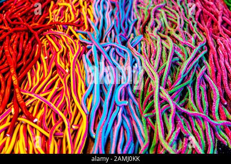Colourful chewy jelly string candy, Christmas by the River market at London Bridge, London, UK Stock Photo
