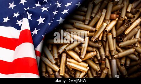 American flag isolated on shotgun cartridges background. Top view, copy space for text. Stock Photo