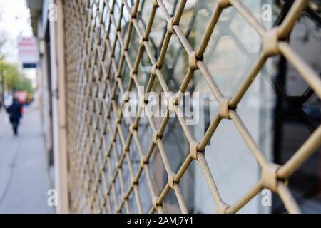 Steel security grill on a shop window. Stock Photo