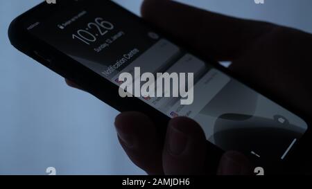 Group of Instagram Social Media Notification Banners on Black Apple iPhone in Hand Close Up Capture Stock Photo