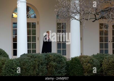 United States President Donald J. Trump gestures to members of the media at the White House in Washington, DC, U.S. as he and First lady Melania Trump depart to attend the College Football Playoff National Championship in New Orleans, Louisiana on Monday, January 13, 2020. The Senate is set to begin his impeachment trial later this week, after Speaker of the United States House of Representatives Nancy Pelosi (Democrat of California) faced increased pressure to send over the two articles of impeachment. Credit: Stefani Reynolds/CNP /MediaPunch Stock Photo