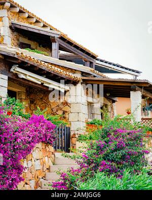 Cottage at Capo Coda Cavallo at Mediterranean sea reflex Stock Photo Cottage at Capo Coda Cavallo at Mediterranean sea reflex Stock Photo
